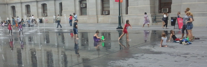 kids playing in srinklers